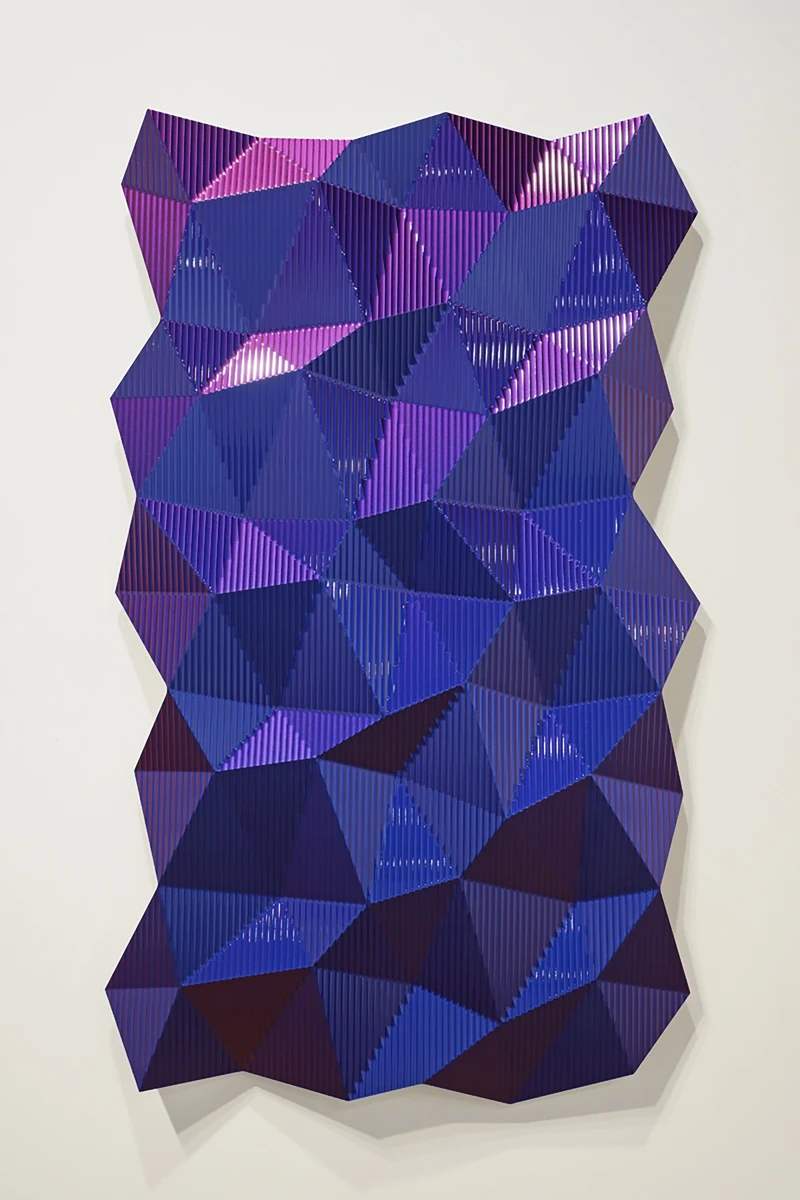 Hexagonal Perturbation, Blue/Red, a faceted violet and magenta machined aluminum wall relief