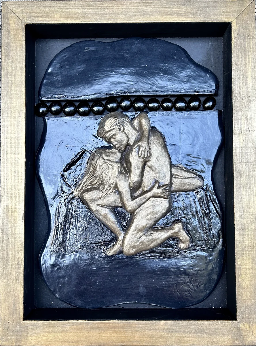 The Kiss, ceramic relief wall hanging set in a wood frame, 12 by 16 inches, two embracing figures modeled in relief