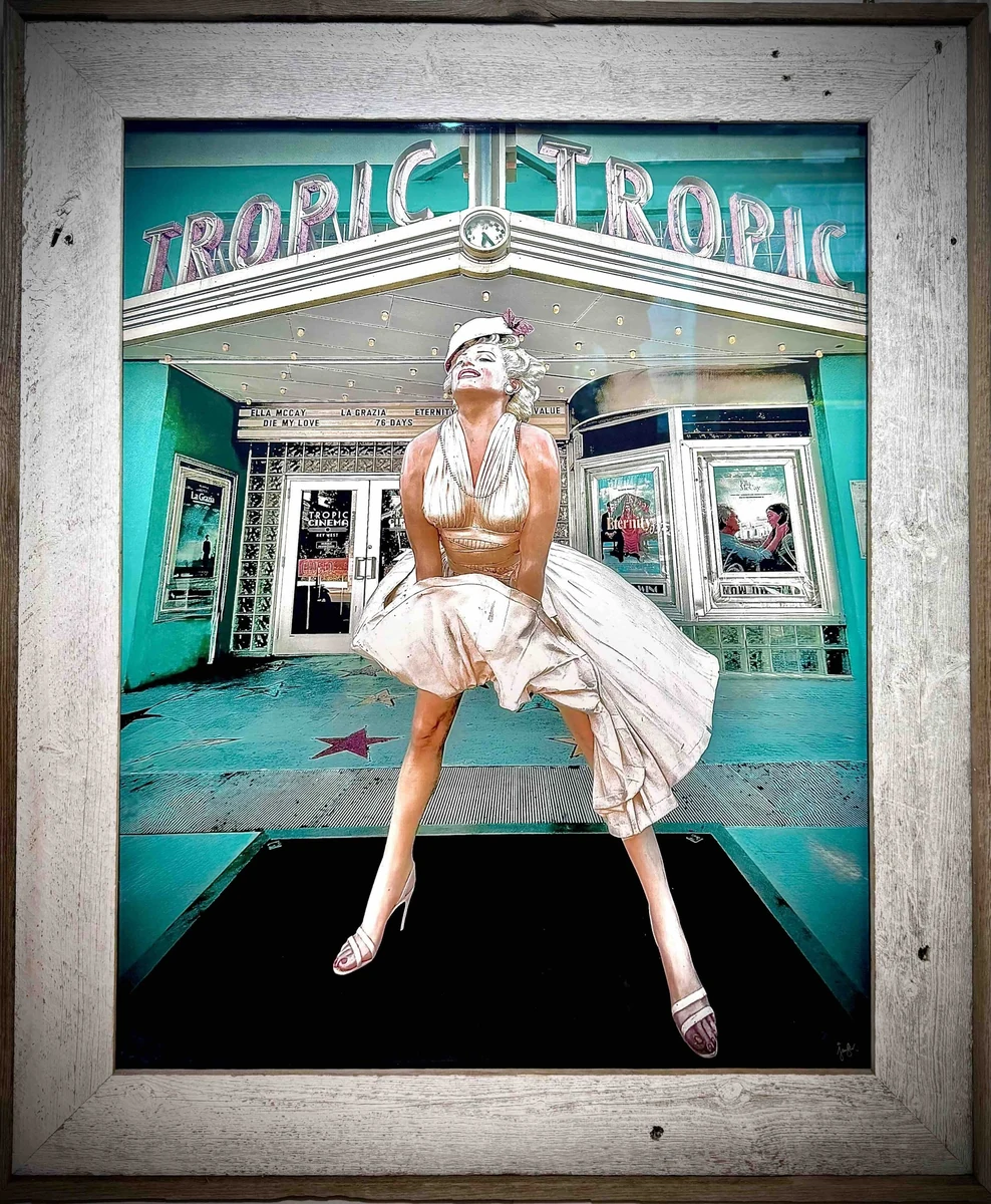 Framed mixed-media photograph of a Marilyn Monroe figure in the white halter dress standing under the teal TROPIC marquee of the Tropic Cinema, Key West