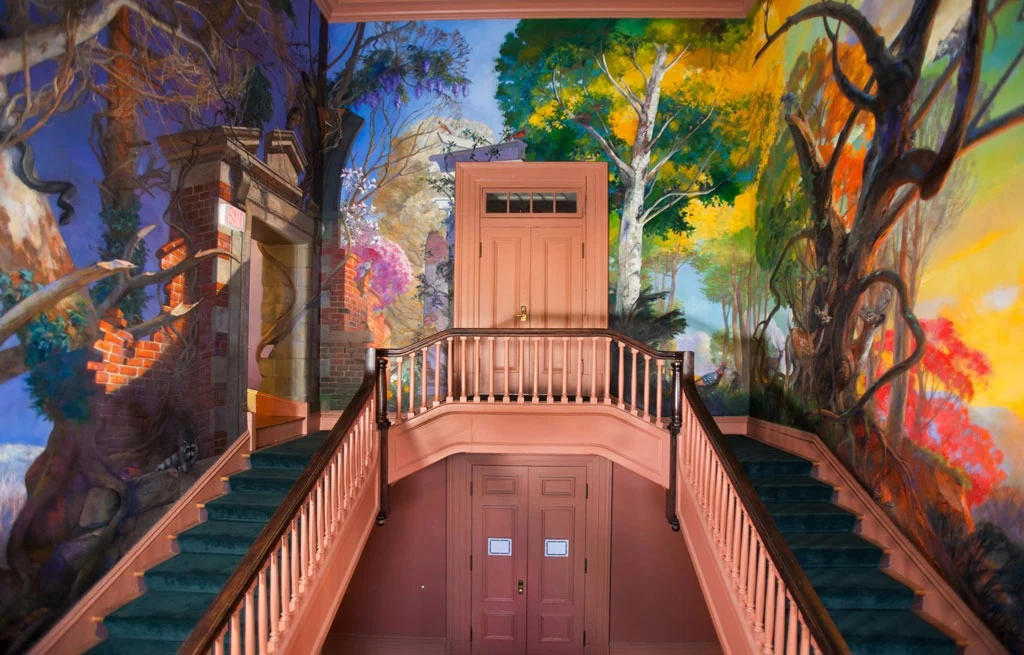 Perry's painted landscape murals installed around a stairwell at the University of Virginia