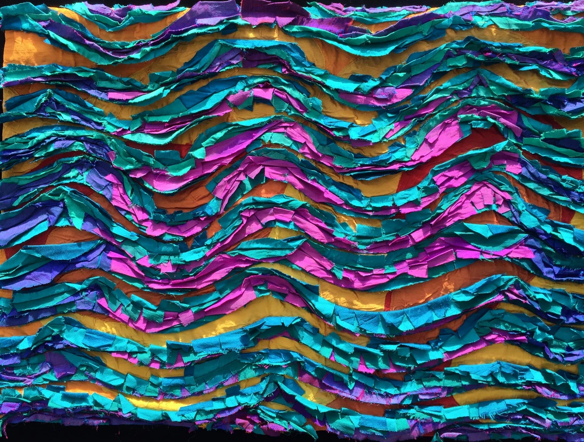 "Ruffles & Flourishes," 41 x 29 inch art quilt of iridescent silks layered and machine stitched in teal, magenta and gold waves with cut, crushed raw edges