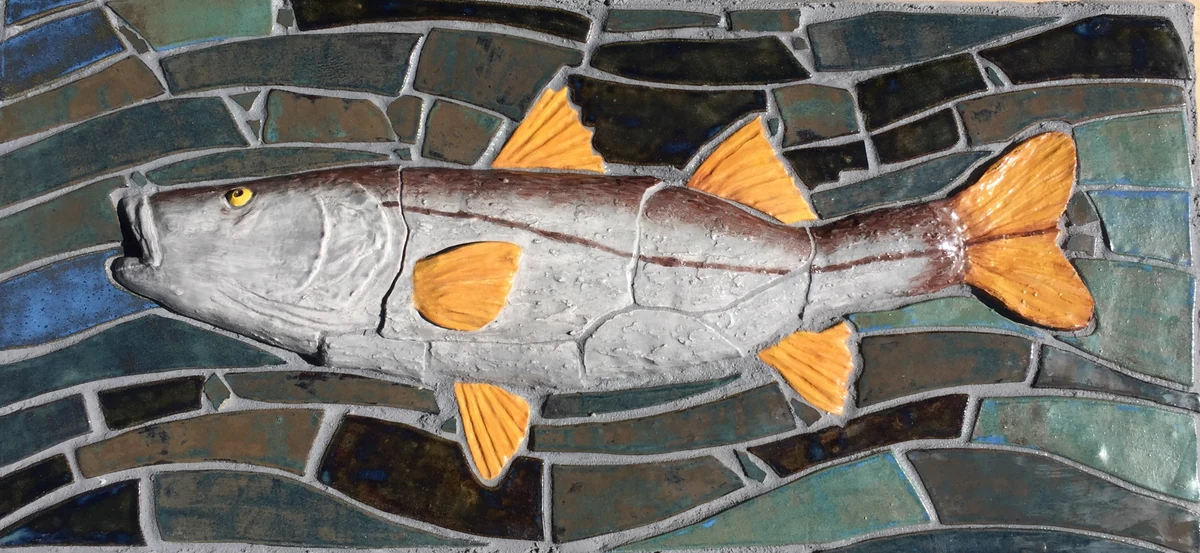 Snook hand-formed mosaic, a relief fish with orange fins set into blue and green tile water